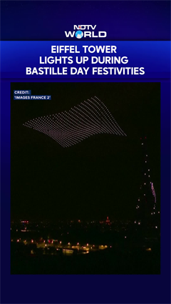 Drone & Fireworks Show Illuminates Eiffel Tower on Eve of Bastille Day in Paris