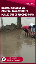Dramatic Rescue Caught On Camera: Two-wheeler Pulled Out From A Flooded Road In MP's Neemuch Dramatic Rescue Caught On Camera: Two-wheeler Pulled Out From A Flooded Road In MP's Neemuch