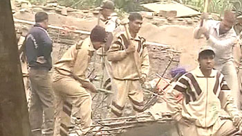 5-storey building crashes, killing 64