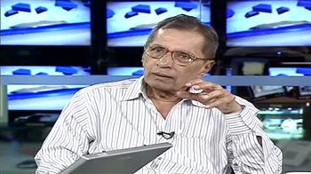 Foreign flows hold rupee up