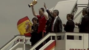 Triumphant homecoming for Spain