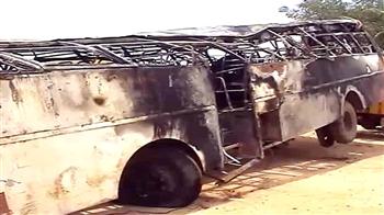 30 dead as bus overturns, catches fire