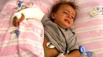 Toddler survives fall from third floor balcony