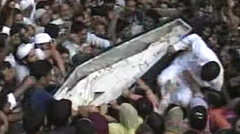 Kashmir: Father's peace appeal at son's funeral