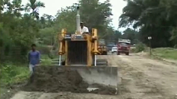 In Assam, a road being built through a reserved forest