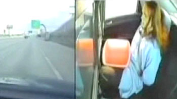 Handcuffed man dives out of police car window