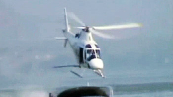 Water skiing barefoot, hitched to a helicopter Water skiing barefoot, hitched to a helicopter