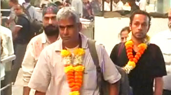 Sailors return from pirate ordeal