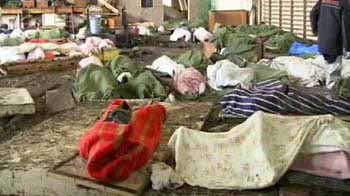 Japan confronts crowded morgues, snow hampers search operations