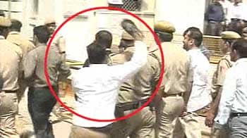 Video : Slipper thrown at Suresh Kalmadi outside court