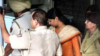 In court today, stoic Kanimozhi manages a smile