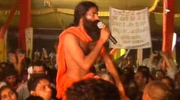 Baba Ramdev jumps off stage, into supporters