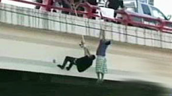 Teen survives being shot, dangled from bridge