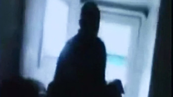 Woman captures attacker's image on cell phone