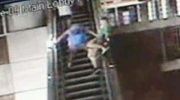 Video : Caught on camera: Drunk teenager falls 20 feet from escalator