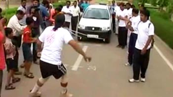 A man who pulls car with his beard