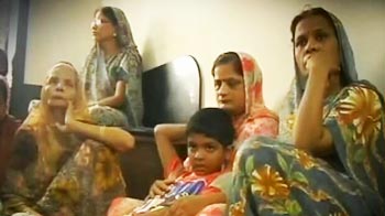 At morgues, shattered families claim their own