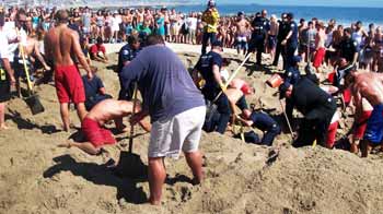 Video : Caught on camera: Teen rescued, was buried under six feet of sand