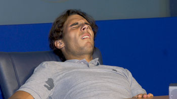 Nadal slumps over with cramps at press conference Nadal slumps over with cramps at press conference