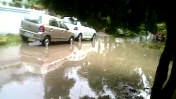 Delhi rain: Residents wade through knee-deep water