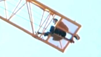 Chinese man climbs atop a crane to commit suicide