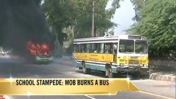 Delhi school stampede: Mob sets bus on fire