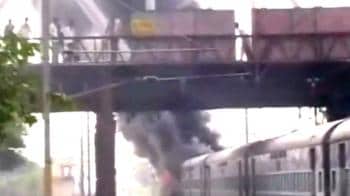 Video : Mob sets train on fire in Uttar Pradesh