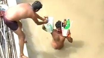 AP: Family stuck on roof
