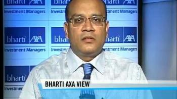 Sensex rallies from sharp losses, gains 92 pts