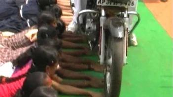 Car, bike drive over 50 kids' hands