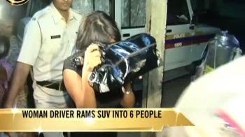 Woman driver rams car into six people