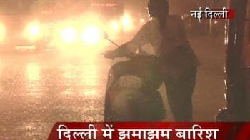Videos : Heavy downpour brings Delhi to a halt