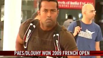 French Open doubles winner Paes returns home
