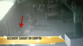 Video : On CCTV: Man caught under train