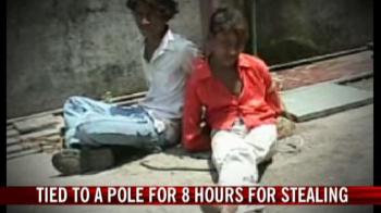 Video : Tied to a pole for eight hours for stealing