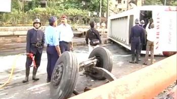 Tourist bus falls off flyover